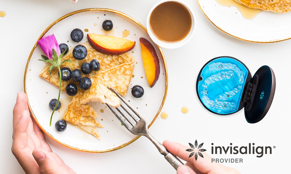 Invisalign dentist at High Park Dental Care consulting with adult patient over 40